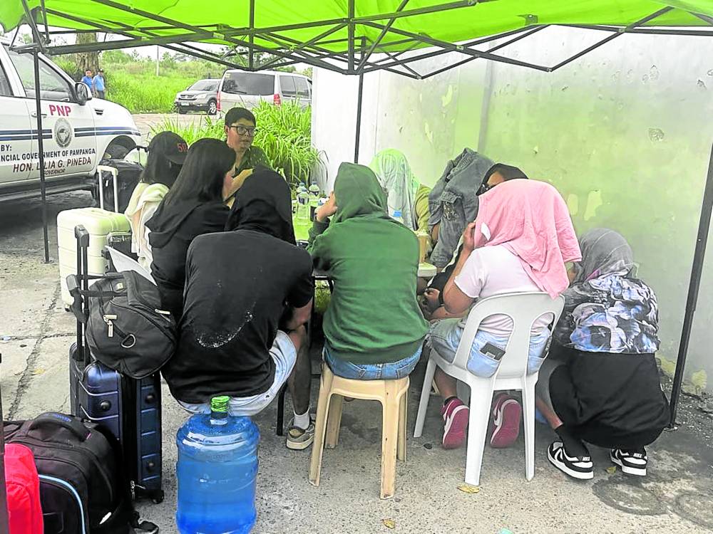‘ROGUE’ COMPANY Wednesday’s raid not only tried to dismantle an alleged human trafficking operation but also revealed the vastness of the private property where the questionable online gaming hub had thrived. —Photos by Jun A. Malig pogo raid leakage