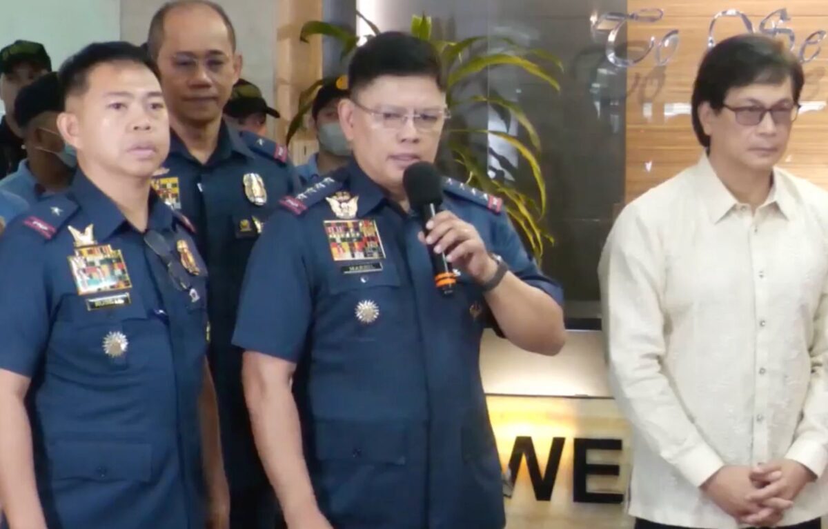 PNP Chief General Rommel Marbil (center) with Southern Police District Director Leon Rosete (left) and Interior and Local Gov't. Secretary Benjamin Abalos Jr. (right) during the presentation of 4 cops allegedly involved in kidnap for ransom and their reported victims. (Photo screengrab from PNP’s Facebook livestream on June 5, 2024)