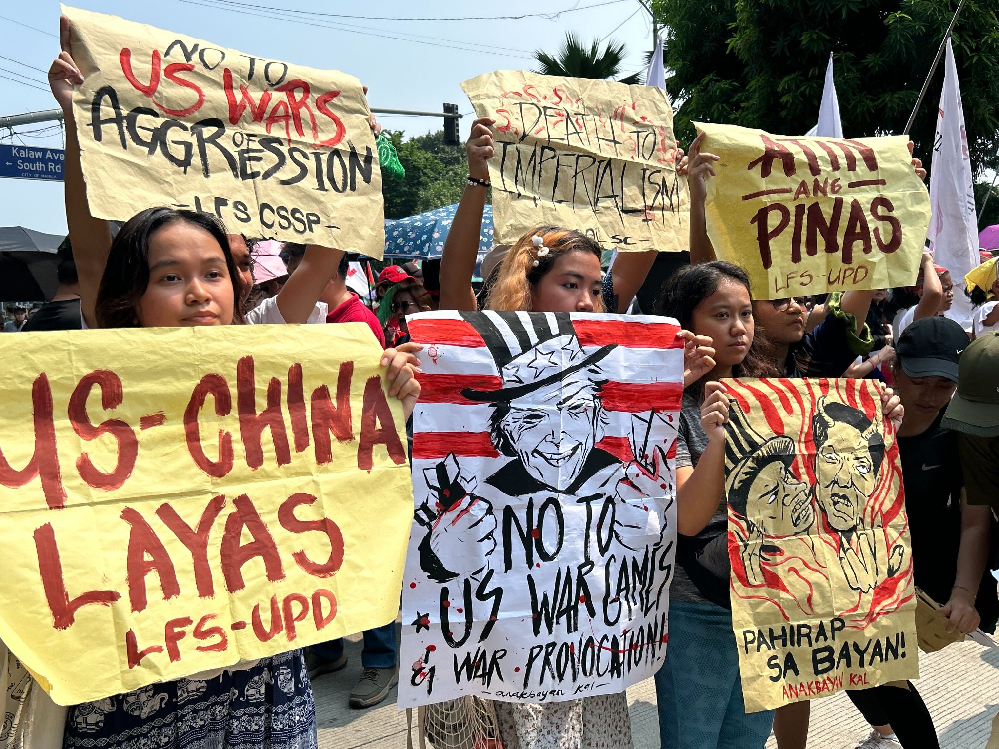 As the nation commemorates its 126th year of independence, members from various progressive groups march along Kalaw Avenue in Manila, condemning what they called the United States' continued "intervention" in the country's affairs, which they claimed affects the ongoing tension between the Philippines and China.