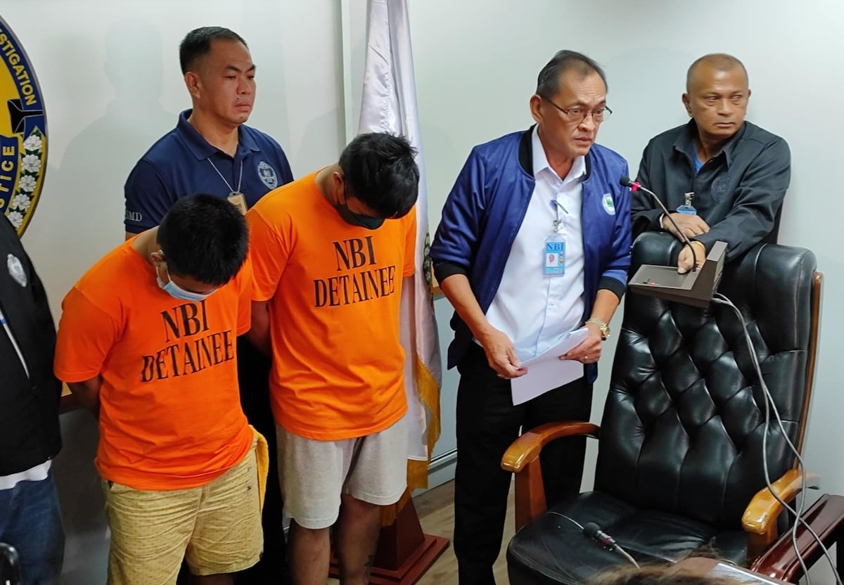 PHOTO: NBI chief Jaime Santiago (second from right) presents the two suspects at the NBI headquarters on Friday, July 26, 2024. STORY: BuCor guard, ex-inmate nabbed as suspects in mother, son killing