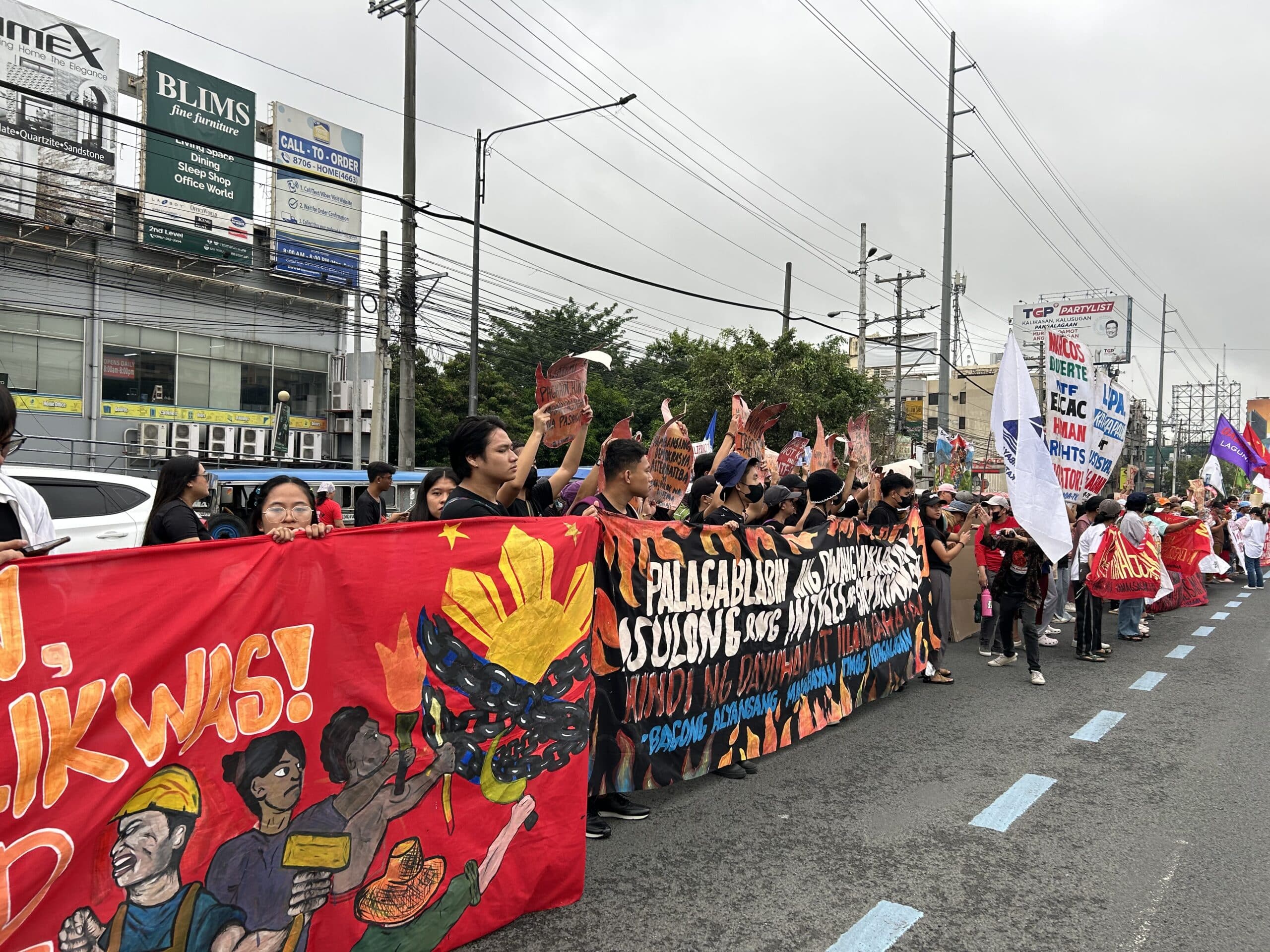 Protesters gather along Commonwealth ahead of Marcos' 3rd Sona