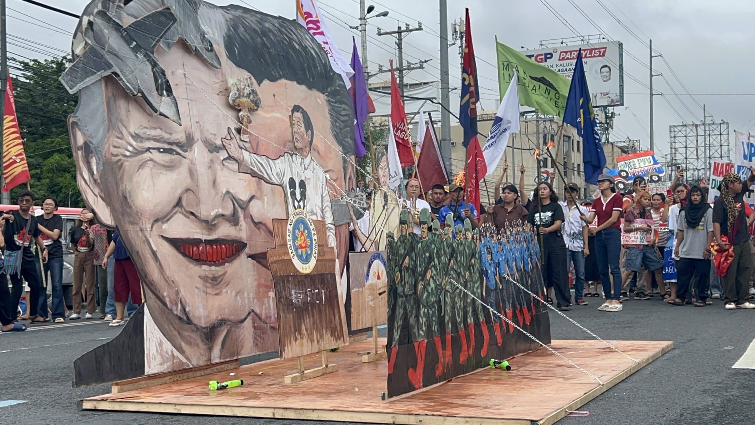 LOOK: Protesters end People’s Sona by burning Marcos-Duterte effigy