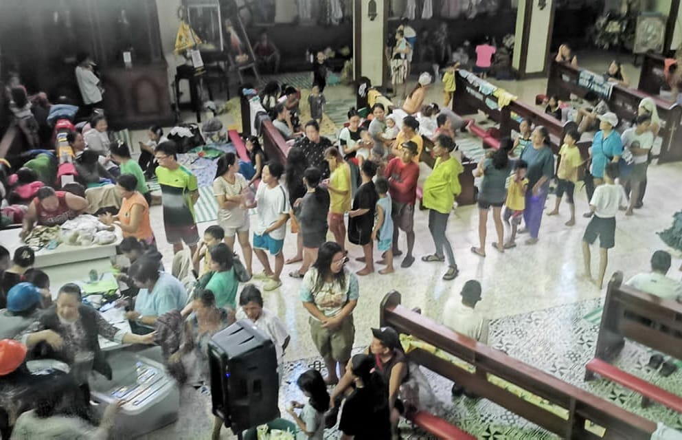 Evacuees fill a church in Roxas District in Quezon City.