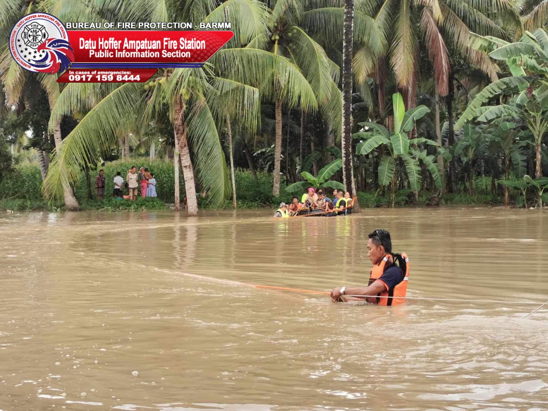 Rescue workers make improvised watercraft in rescuing trapped civilians in Datu Hofer, Maguindanao del Sur as the Labu-Labu river overflowed Friday night.
