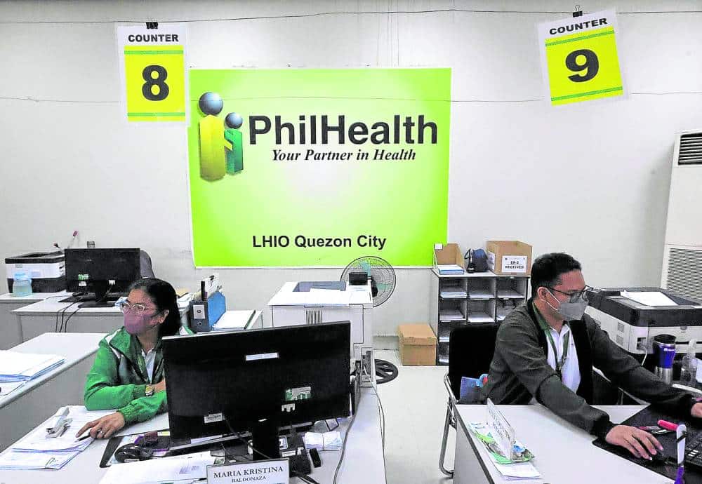 Employees working in the PhilHealth offices.