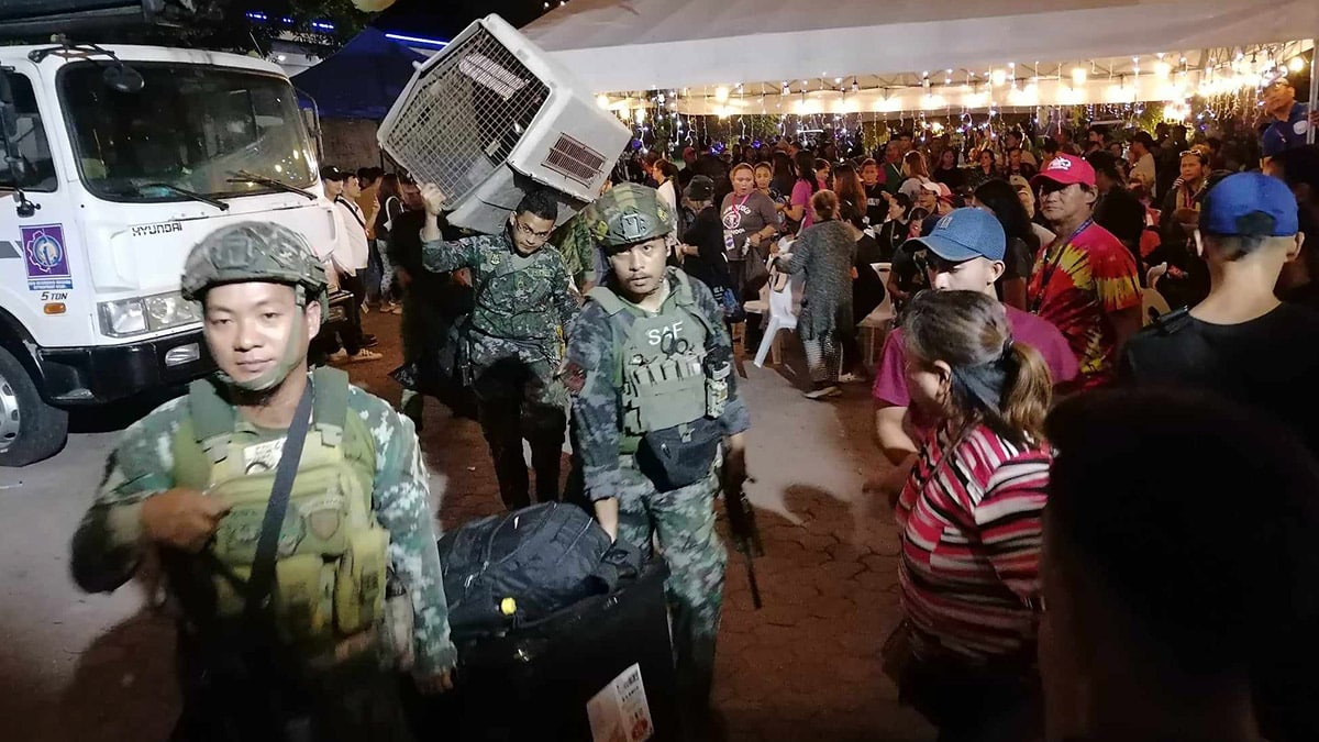 PACKING UP After two weeks at the Kingdom of Jesus Christ compound, police begin to move out on Sunday night following the government’s announcement that it has the sect’s leader Apollo Quiboloy already in its custody. —JOSELLE R. BADILLA