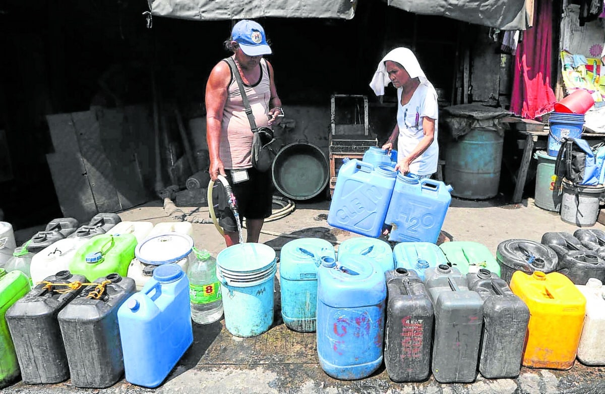 HIGH AND DRY A man refills water gallons along Road 10, Tondo, Manila, at the height of this year’s El Niño phenomenon in this March 2024 photo. Water shortages are becoming more severe due to climate change, urban sprawl, overexploitation, pollution, and misgovernance.