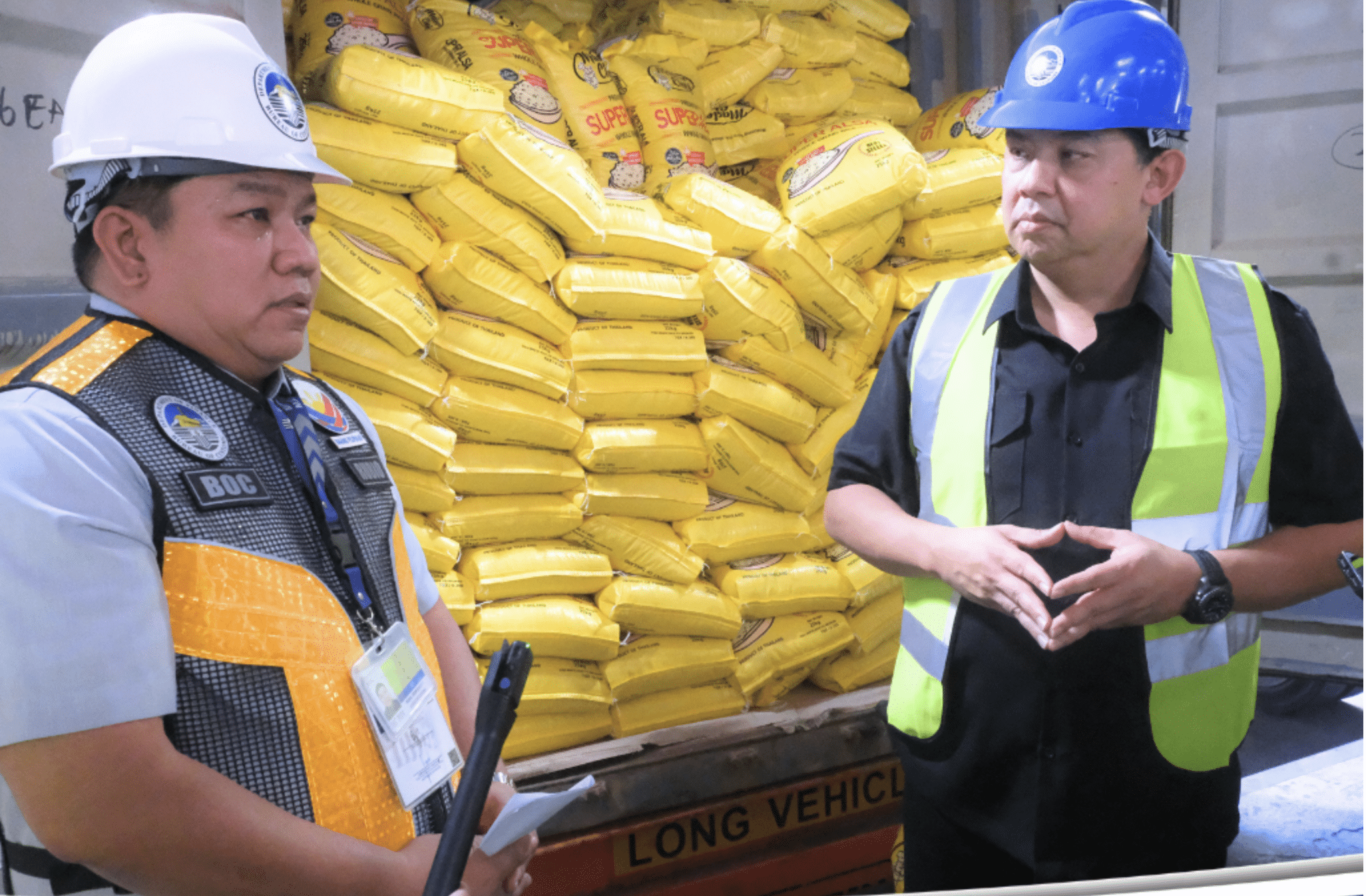 Customs Commissioner Bienvenido Rubio and House Speaker Martin Romualdez inspect rice shipments at the Manila International Container Port on Sept. 25, 2024. 