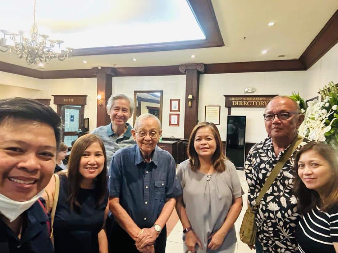 Dan Mariano, sixth from the left, with his former media co-workers during his wife's wake in February.