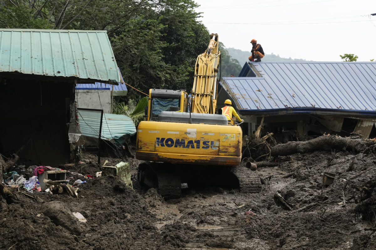 Rescuers work at the site after a recent landslide triggered by Tropical Storm Trami struck Talisay, Batangas province, Philippines leaving thousands homeless and several villagers dead on Saturday, Oct. 26, 2024.