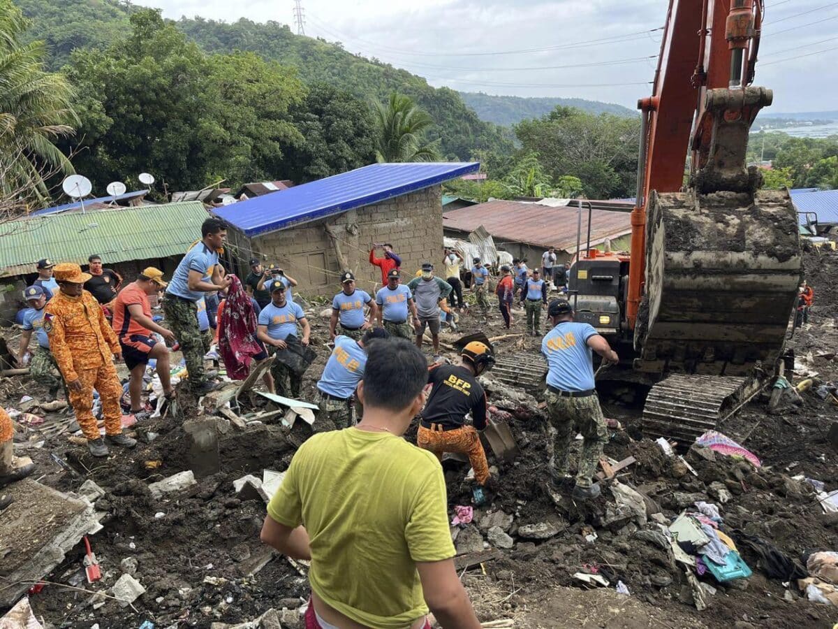 Volunteers continue rescue operations after a recent landslide triggered by Tropical Storm Trami struck Talisay, Batangas province, Philippines leaving thousands homeless and several villagers dead on Saturday, Oct. 26, 2024.