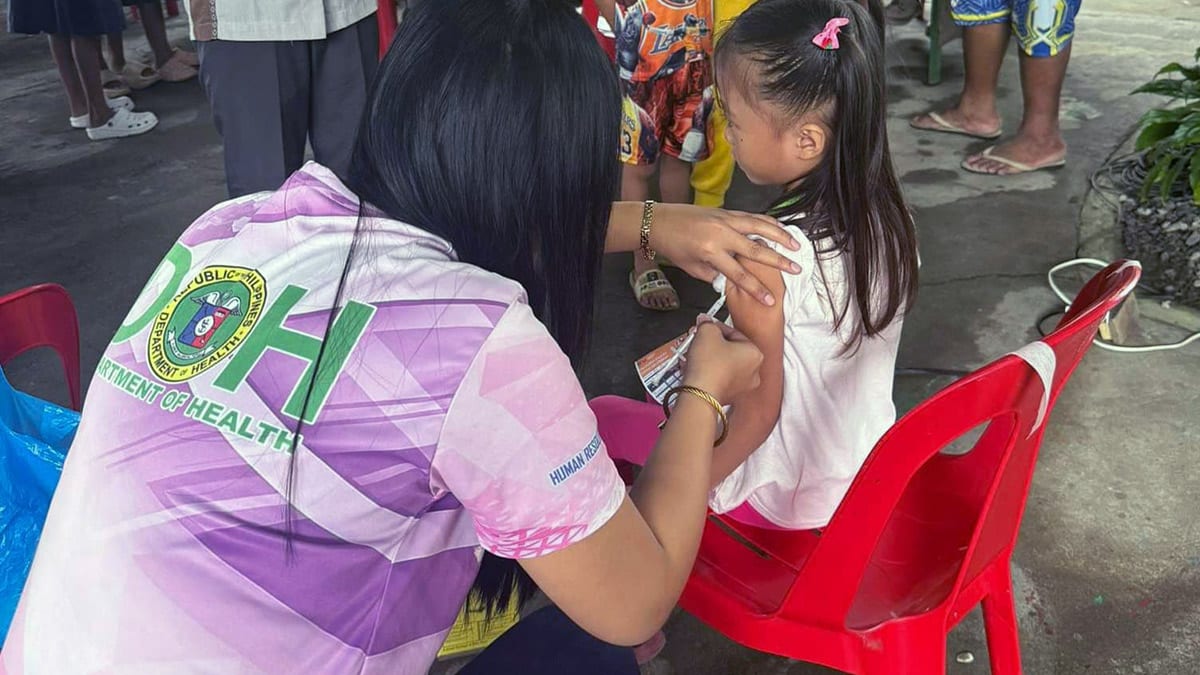 VACCINATION. A Department of Health personnel administers a vaccine to a grade school learner in Ilocos Norte in this undated photo. As of Oct. 13, 2024, about 26,000 learners in the Ilocos Region have received the measles-rubella and tetanus-diphtheria vaccines as part of the resumption of the school-based immunization program dubbed “Bakuna Eskwela” of the Department of Health and the Department of Education.