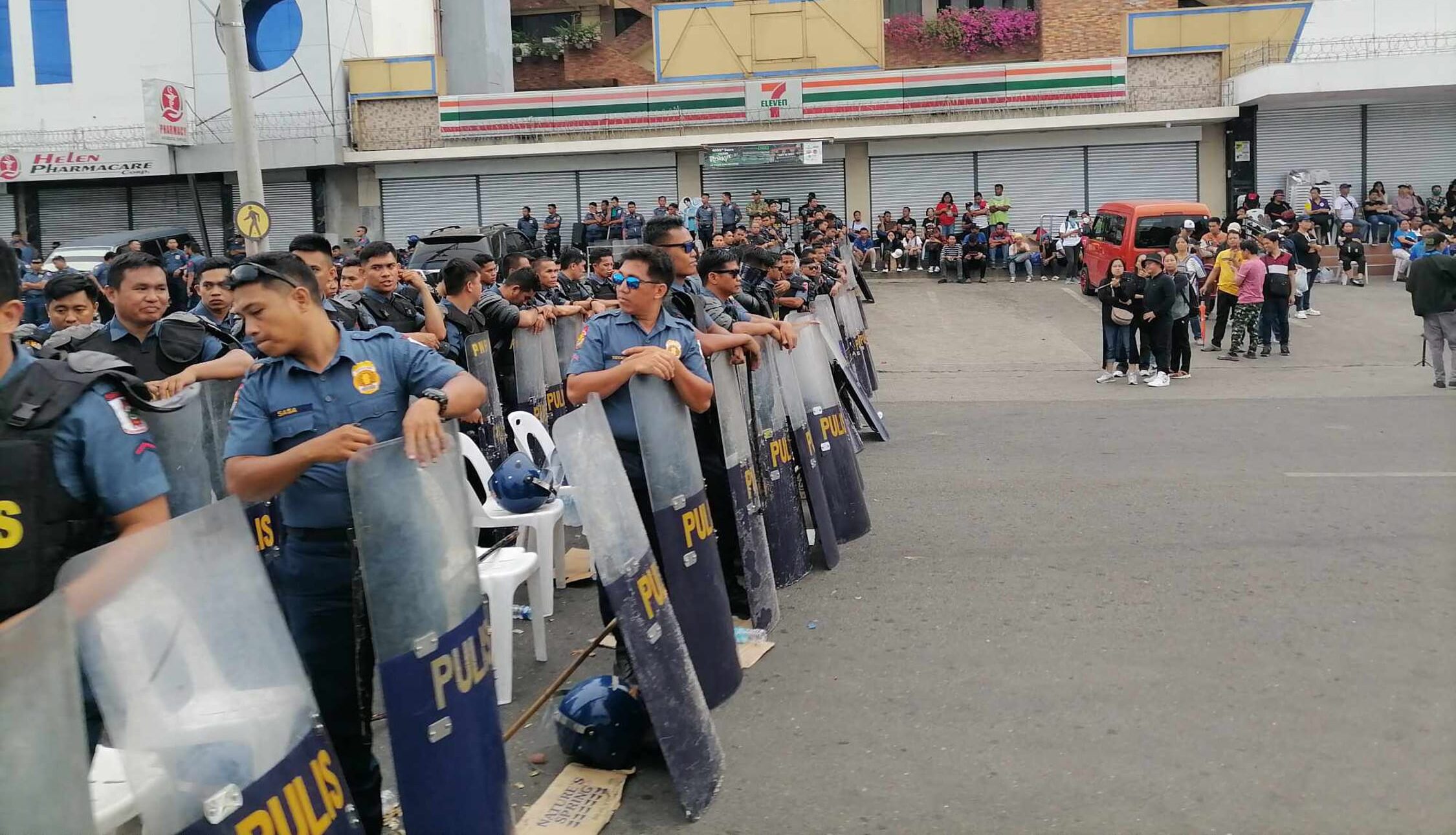 ‘KINGDOM’ SIEGE Antiriot policemen assemble outside theKingdom of Jesus Christ compound in Davao City in this photo taken on Aug. 29, at the height of the massive manhunt for the sect’s controversial founder and televangelist Apollo Quiboloy.