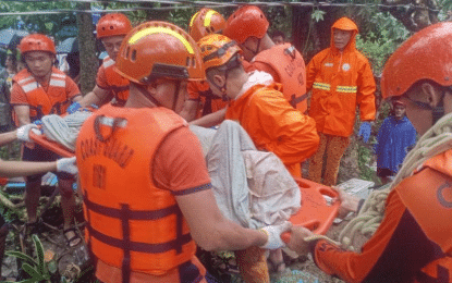 RESCUE OPS. Philippine Coast Guard rescuers assist in the retrieval of the bodies of two residents after a landslide in Sitio Libas, Barangay Maguiton, Guinobatan, Albay on Oct. 23, 2024. The Office of Civil Defense on Tuesday (Oct. 29) said government responders have so far rescued 169,769 individuals affected by Several Tropical Storm Kristine. (Photo courtesy of PCG)