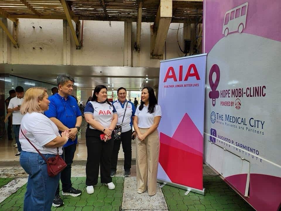 Mayor Joy Belmonte visits Hope for the Breast program with QC doctors and AIA officers.