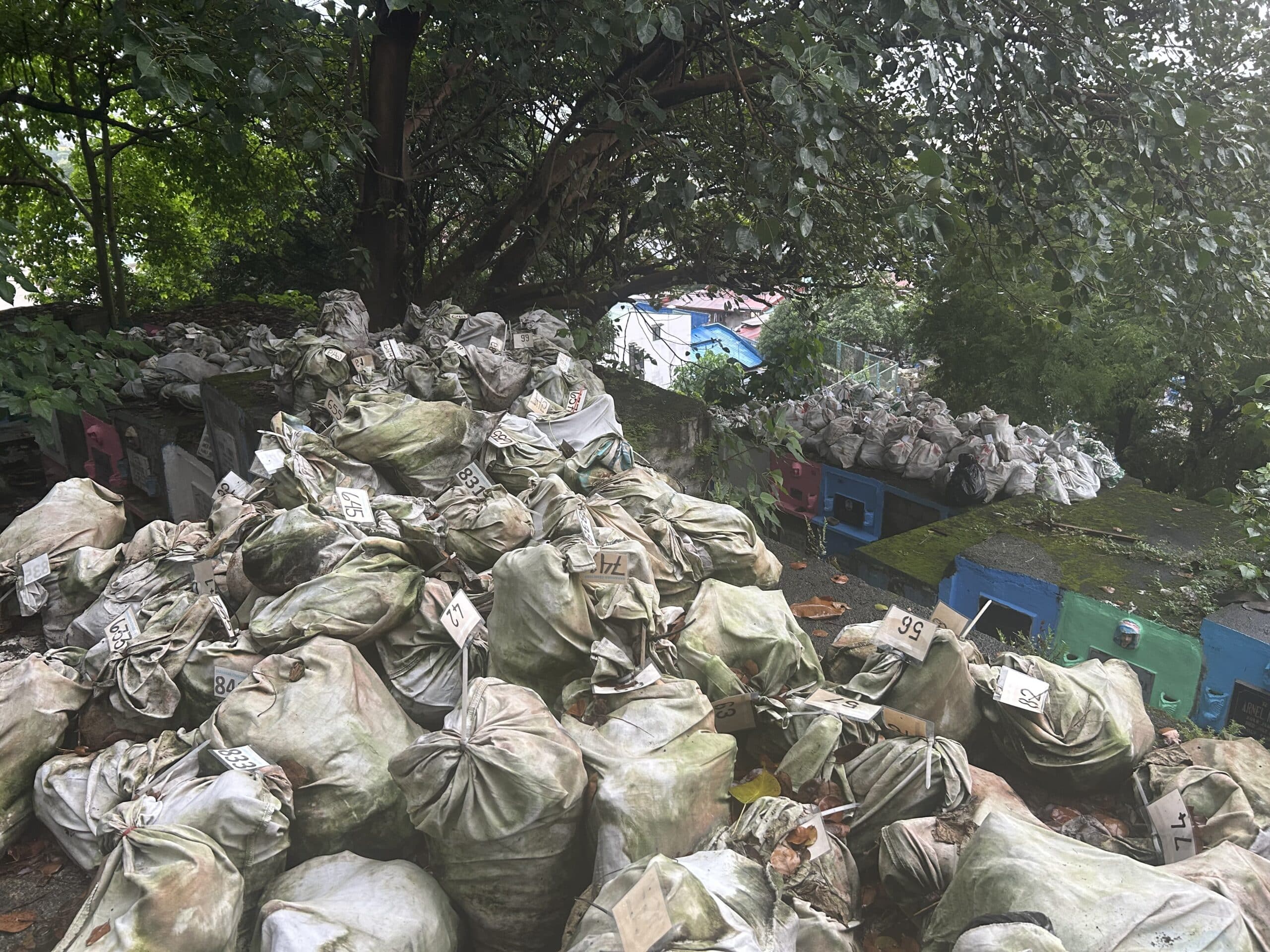 Eight hundred sacks of human remains are seen here stacked in the upper section of Barangka Public Cemetery, following the exhumation of bones that exceeded the five-year “rental period.”