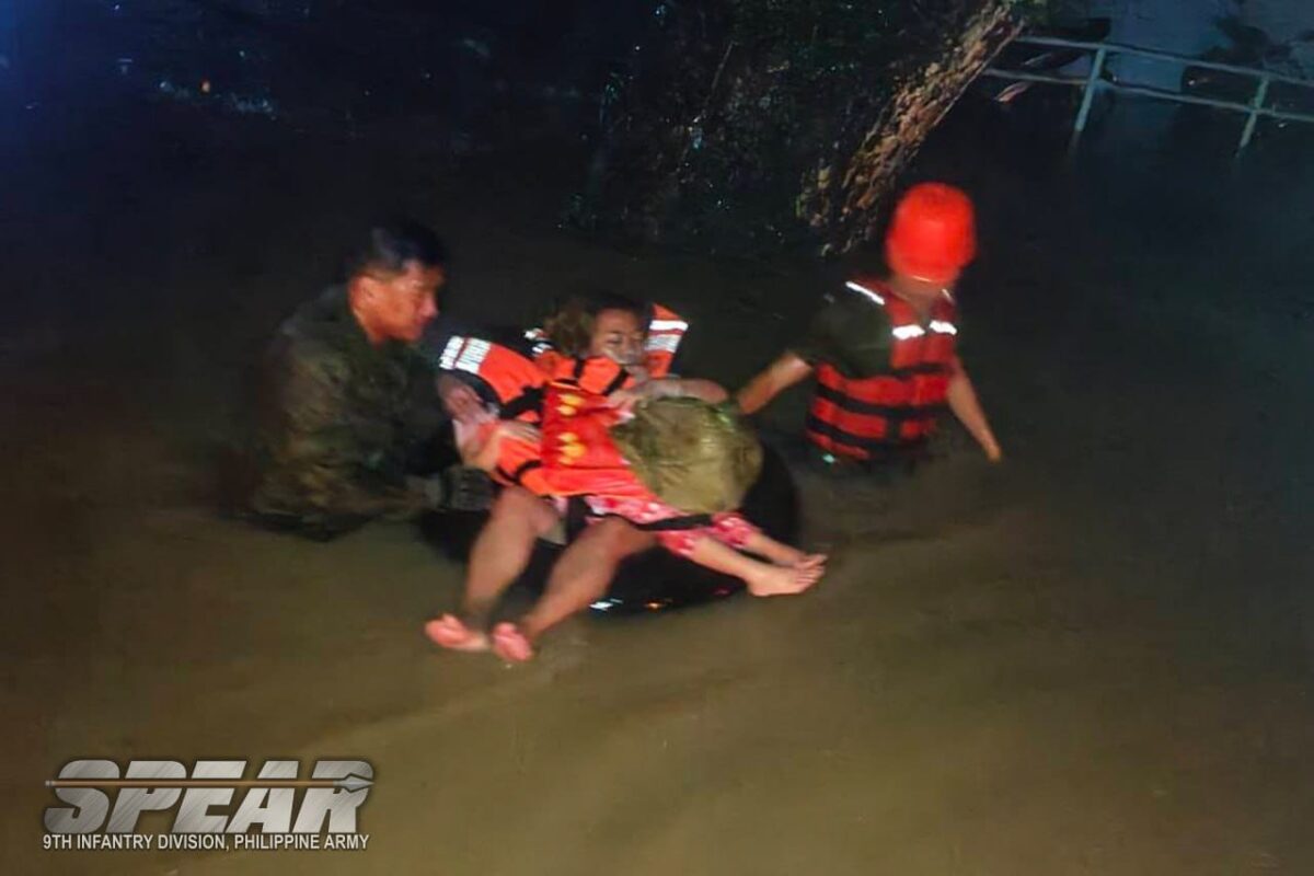 ⁨Rescuers from the 9th Infantry Division saved a woman amid the massive flooding due to Tropical Storm Kristine in the Bicol Region on October 22, 2024.⁩