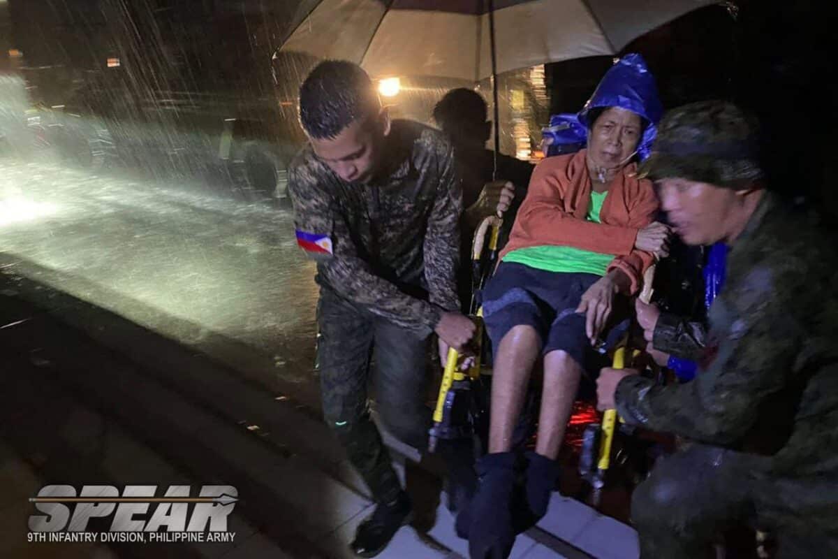 ⁨⁨Rescuers from the 9th Infantry Division saved an elderly woman amid the flooding due to Tropical Storm Kristine in Bicol Region on October 22, 2024.⁩⁩