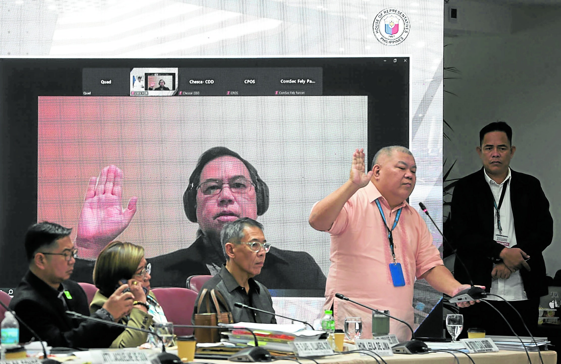 Former PCol Eduardo Acierto (in dark shirt) takes his oath via recorded Zoom during the 10th Quad Comm hearing held at the House of Representatives. 