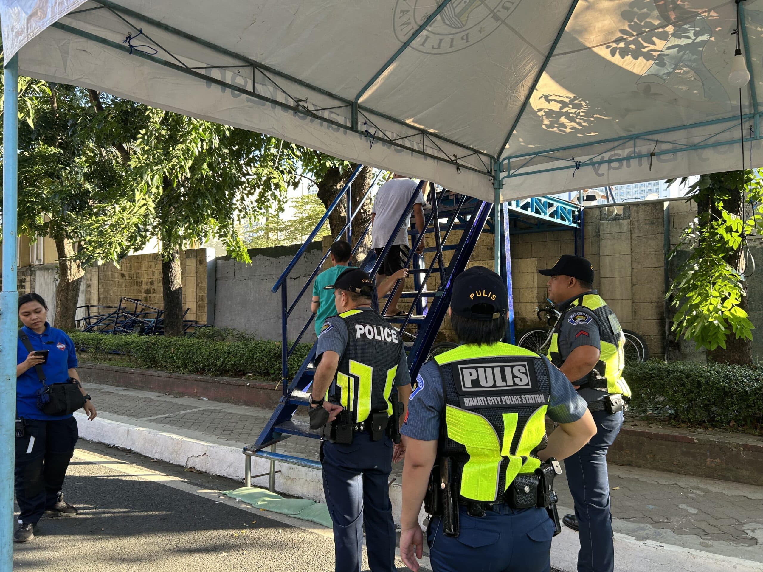 Officials at the Manila South Cemetery set up a makeshift entrance over the site’s northern wall along Kalayaan Avenue for greater access to visitors on Friday, Nov. 1. Photo by Jason Sigales