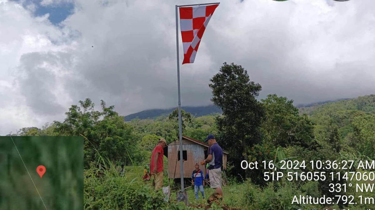 DEMARCATION POINT. The first flag marking the four-kilometer radius of the permanent danger zone around Mt. Kanlaon installed in the area of Barangay Biak na Bato, La Castellana, Negros Occidental on Oct. 16, 2024. More flags will be installed along the demarcation points in the coming months, the Office of Civil Defense-Western Visayas said in a statement on Sunday (Nov. 3). (Photo courtesy of PENRO-Negros Occidental)