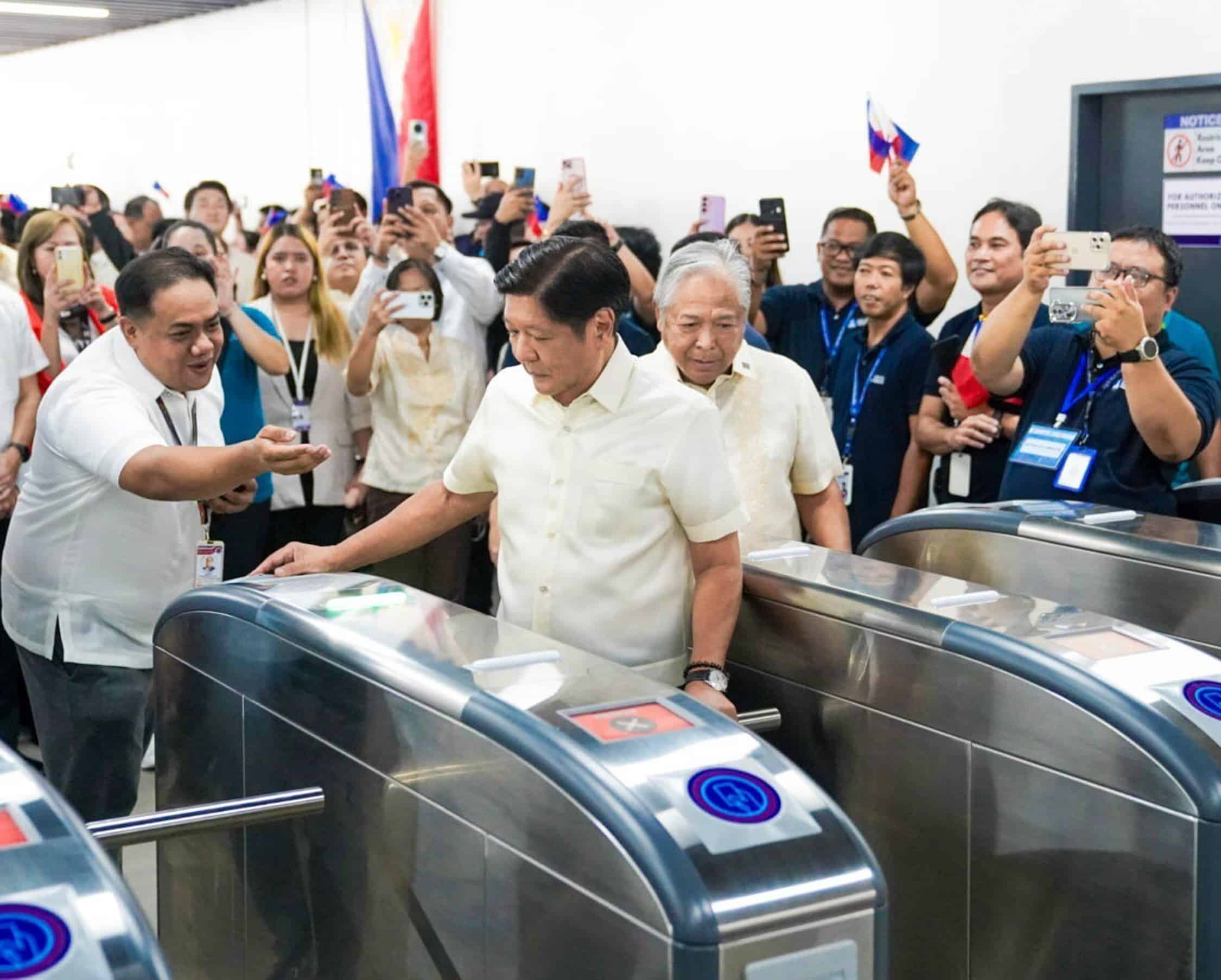 TRAIN LAUNCH President Marcos checks in his ticketduring the inauguration of the LRT Cavite extension project.