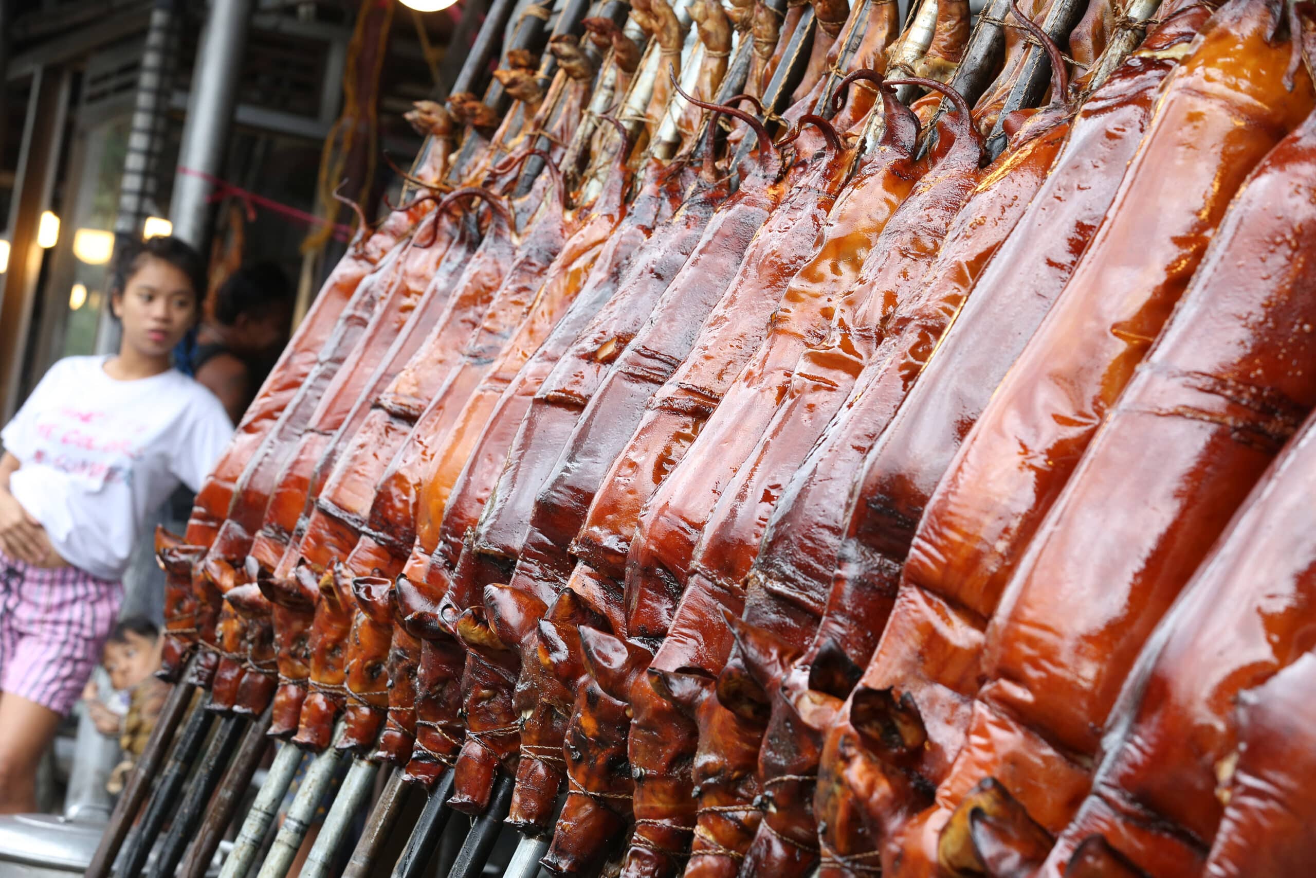 FAT IS FLAVOR File photo shows a row of roasted hogs. pork christmas