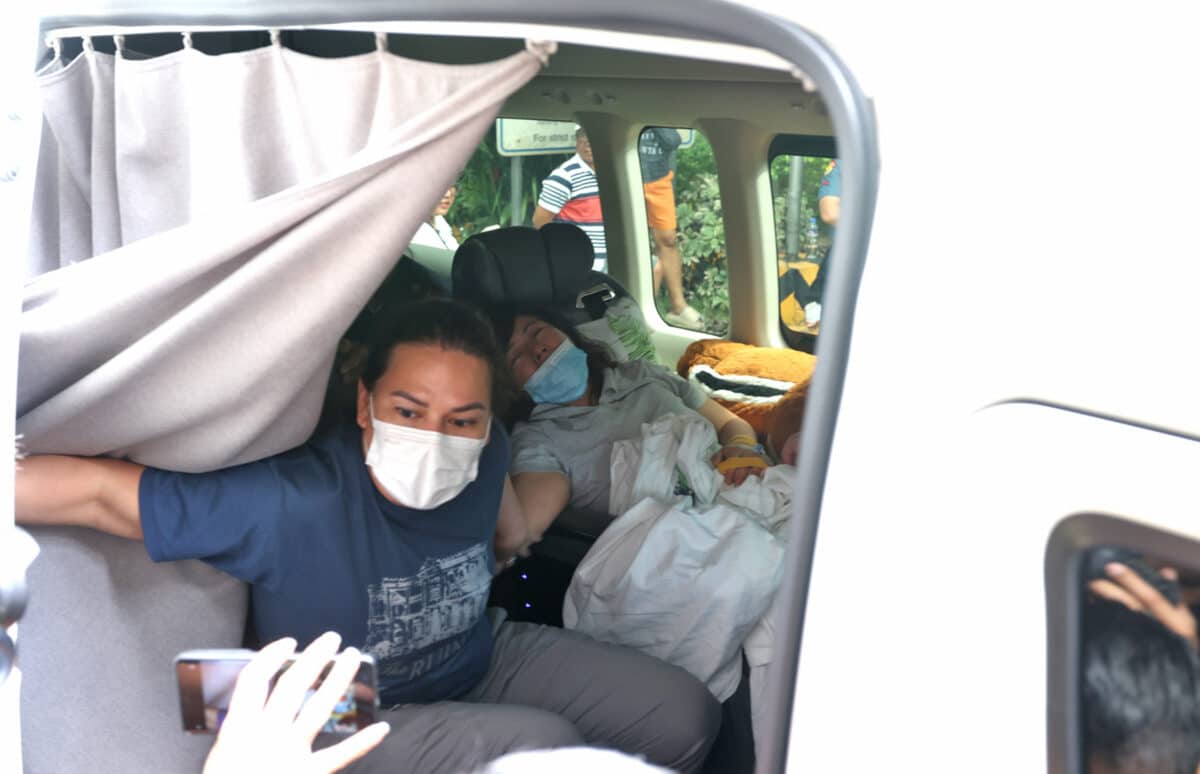 SHE WON’T LEAVE Vice President Sara Duterte accompanies her chief of staff Zuleika Lopez as they leave St. Luke’s Medical Center in Quezon City on Saturday, in a tense episode in the standoff that started Friday night between Duterte and the House leaders who earlier ordered Lopez detained.