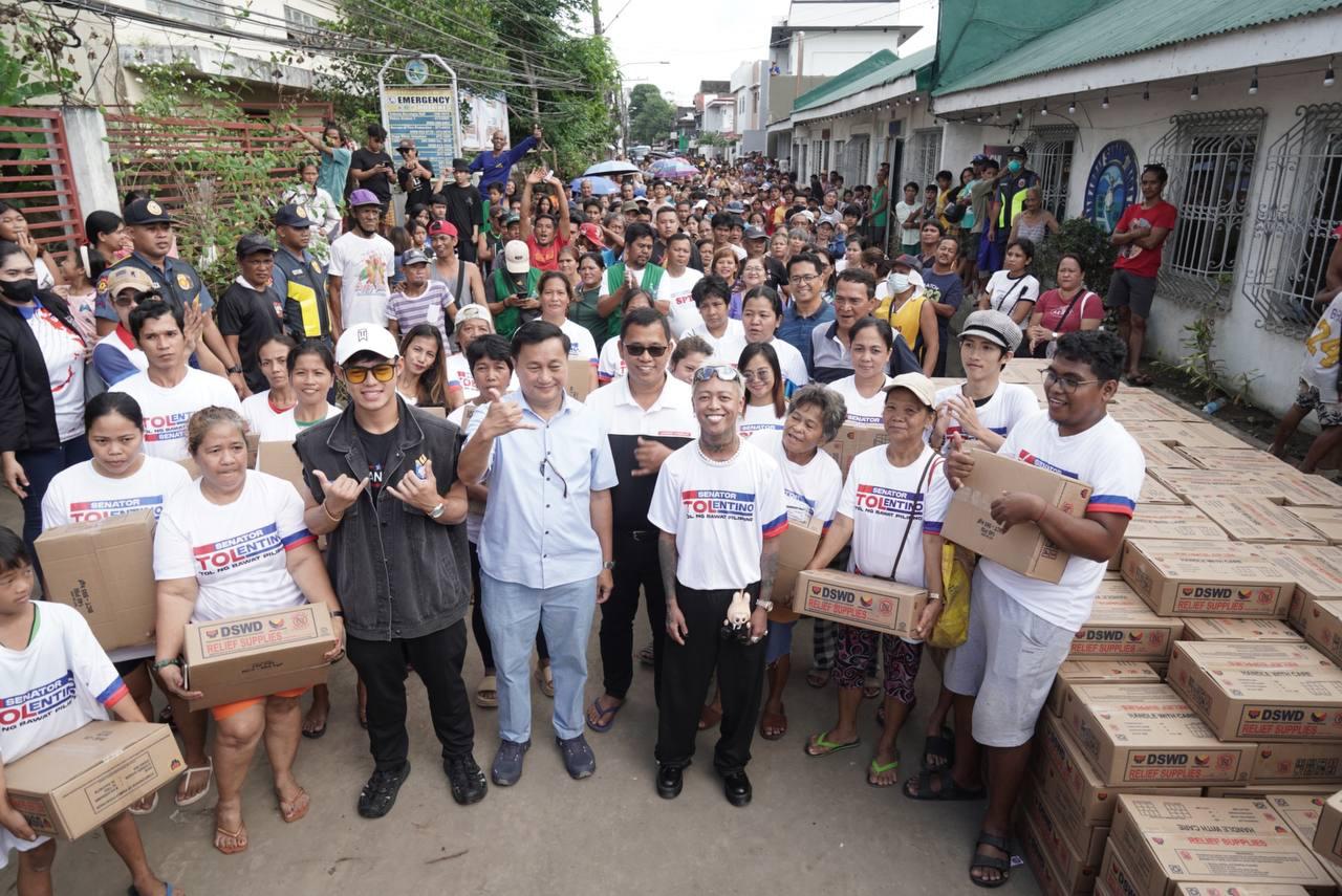 Senate Majority Leader Francis "Tol" Tolentino handing over boxes of relief goods to 7,241 families in the regions worst hit by the recent disaster.