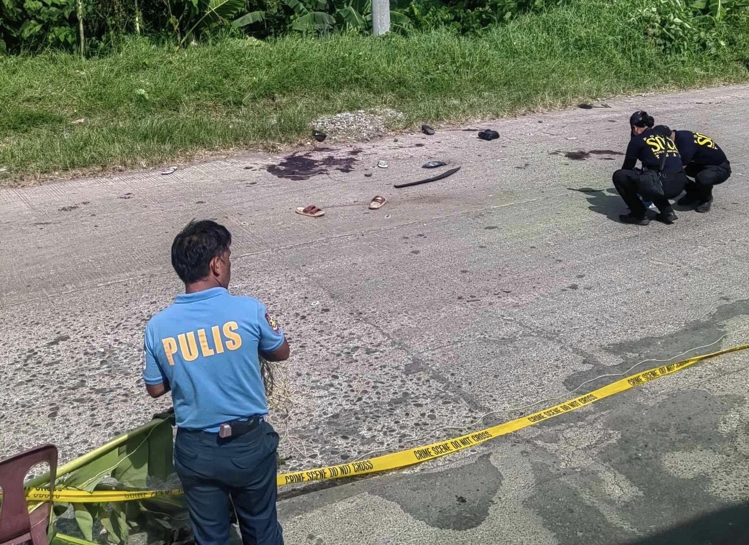 Police Scene of the Crime Operatives (SOCO) conduct post crime investigation in Barangay Crossing Simuay, Sultan Kudarat, Maguindanao del Norte. (Photo by DXMS Radio)