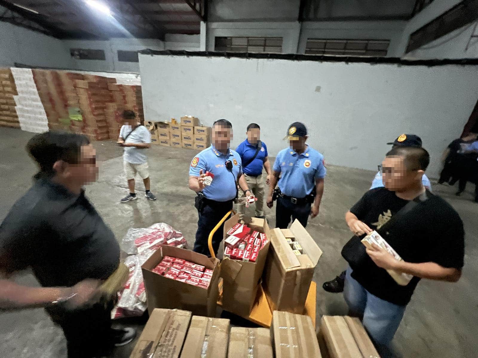 Philippine National Police Criminal Investigation and Detection Group seizes fake cigarettes during a series of raids in Bulacan and Valenzuela.