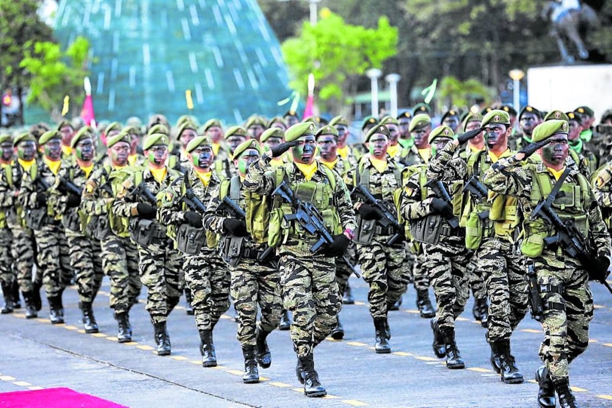 PHOTO: AFP troops marching FOR STORY: Bicam sustains allowance hike for military troops to P350 daily