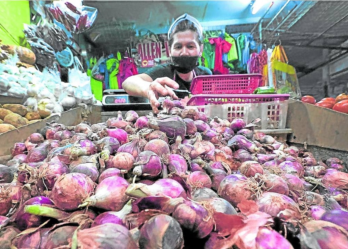 PHOTO: Vendor with her onions at the market FOR STORY: NBI asked to check middlemen’s role in food price manipulation