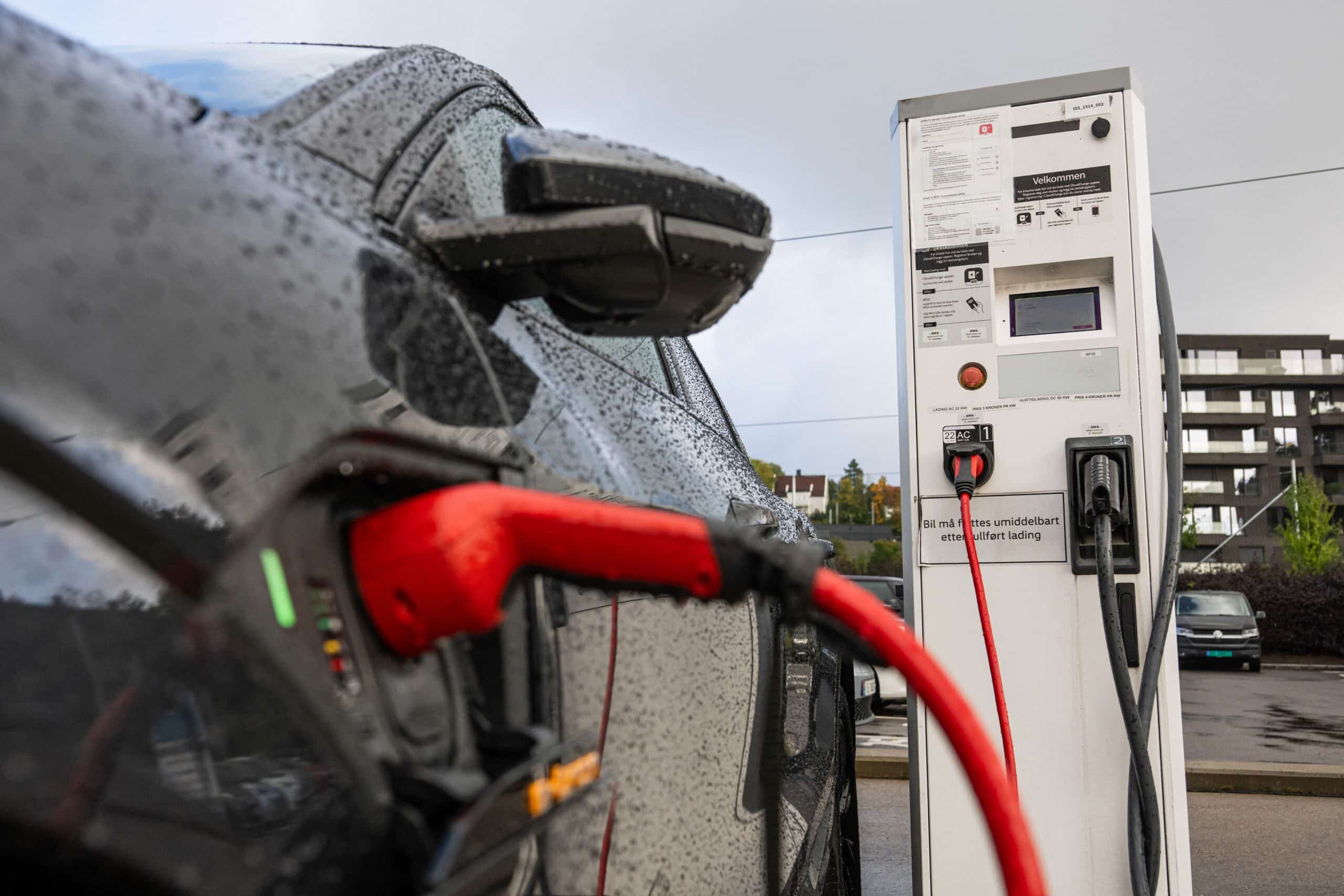 An electric vehicle of German car manufacturer Audi is charged via a charging station outside the Norwegian capital Oslo on September 25, 2024. (Photo by Jonathan NACKSTRAND / AFP)