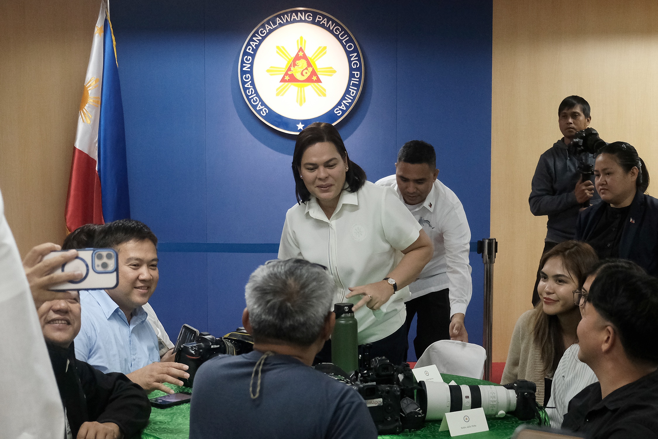 MEDIA LUNCH Vice President Sara Duterte mingles with photographersand TV crews during the thanksgiving lunch held at her Mandaluyong City office on Wednesday, the day she was also supposed to appear at the National Bureau of Investigation.