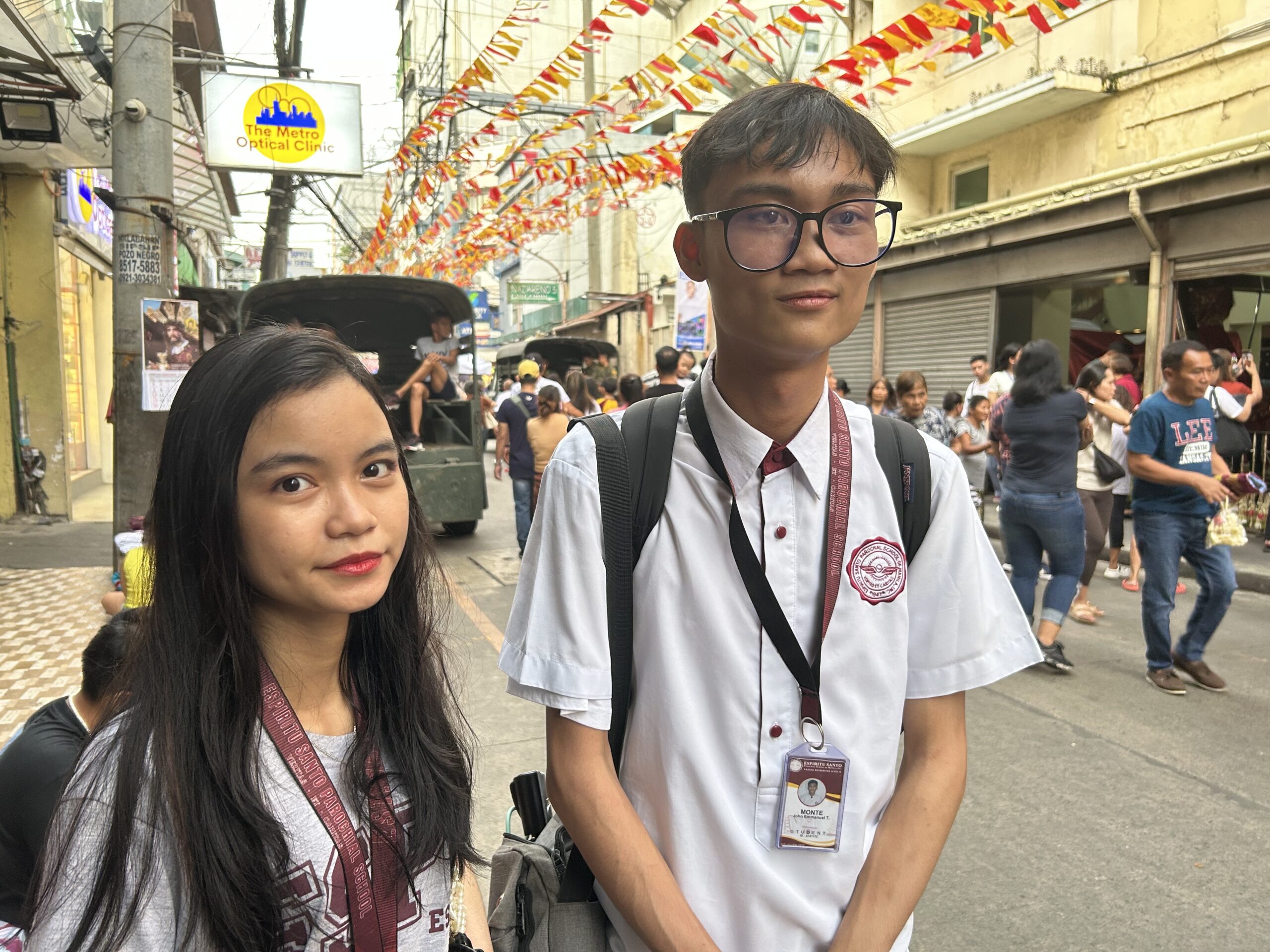 Grade 12 students John Emmanuel Monte, 17, and Jelaine Kyla Flores, 18, visit replica images of Jesus Nazareno at the Quiapo Church on Wednesday afternoon, Jan. 8, 2024, as part of their religious devotion. (Photo by Jason Sigales / INQUIRER.net)