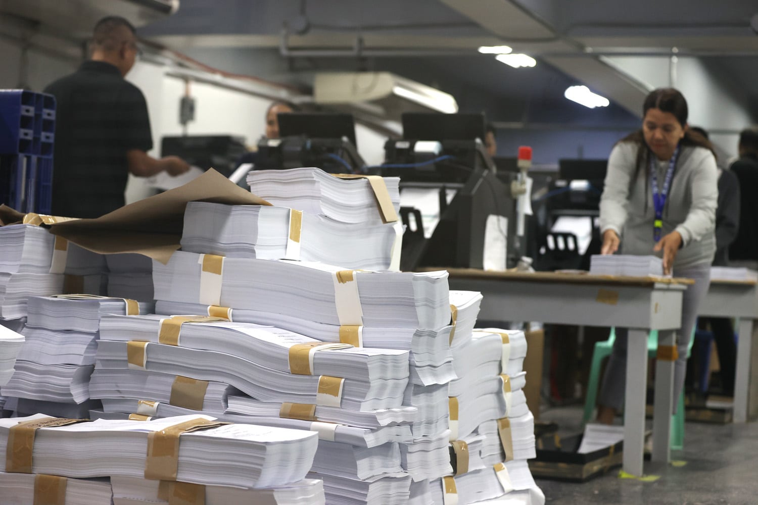 MUST START OVER Photo taken at the National Printing Office in Quezon City on Wednesdayshows some stacks of the ballots already printed for use in the May 12 elections, but will now have to be discarded in view of the Supreme Court order for the Comelec to include the names of five more candidates. 