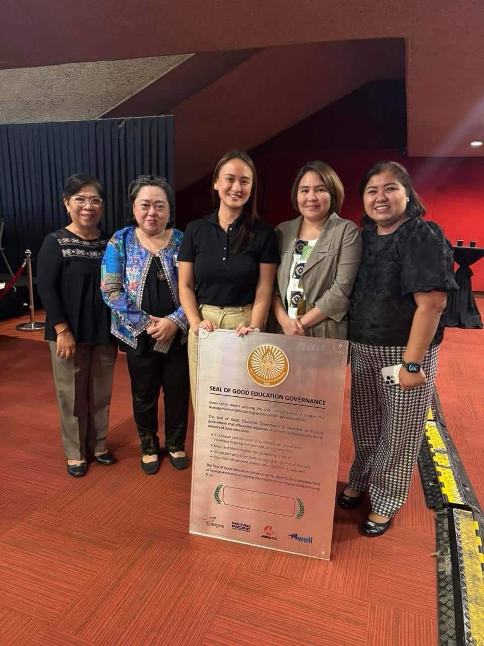 Receiving the awards were Coun. Aly Medalla, Education Affairs Unit OIC Ms. Maricris Veloso, and Schools Division Superintendent Ms. Carleen Sedilla,