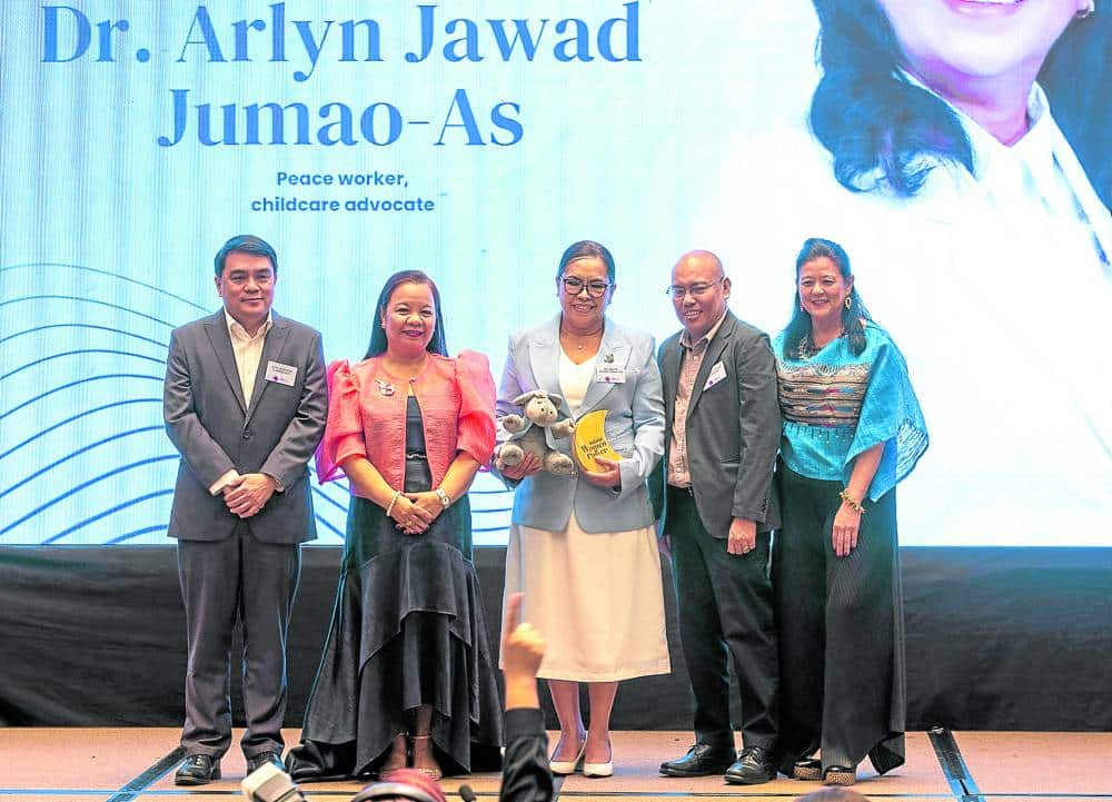Dr. Arlyn Jawad Jumao-As, Peace Worker, Childcare Advocate, receives the award from Rudyard Arbolado, President and CEO of Philippine Daily Inquirer, Juliet Labog-Javella, Philippine Daily Inquirer Associate Publisher, Joseph Voltaire Contreras, Philippine Daily Inquirer, Executive Editor and Sandy Prieto-Romualdez, Inquirer Group of Companied Head, during the Philippine Daily Inquirer 3rd Women of Power Awards with the theme "Seizing the Day. Strenghening the Future.", at the Hilton Hotel in Pasay City on Monday, March 24, 2025.