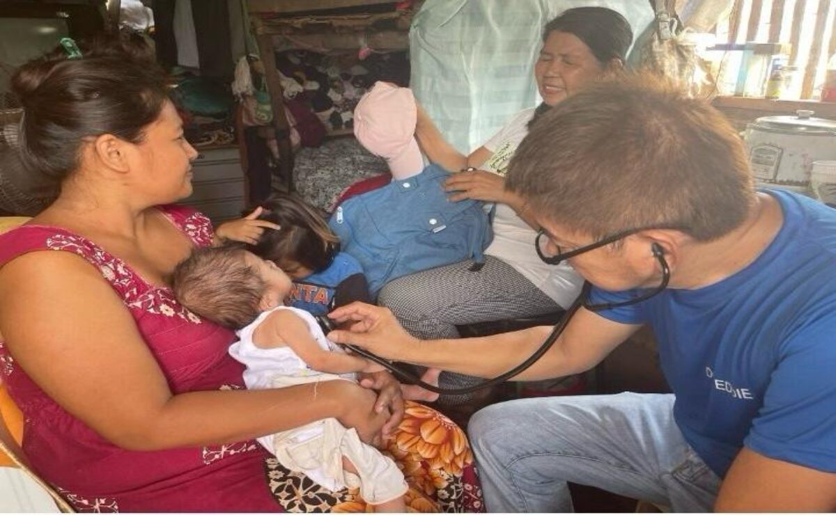 Dr. Eddie Dorotan checks on a patient