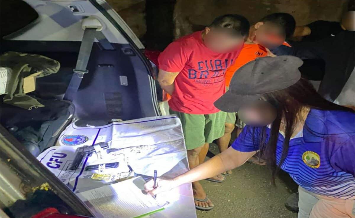 A police officer takes an inventory of items seized from two suspected gunrunners following a sting operation in Cebu City staged over several days by the Criminal Investigation and Detection Group. — Photo from the CIDG
