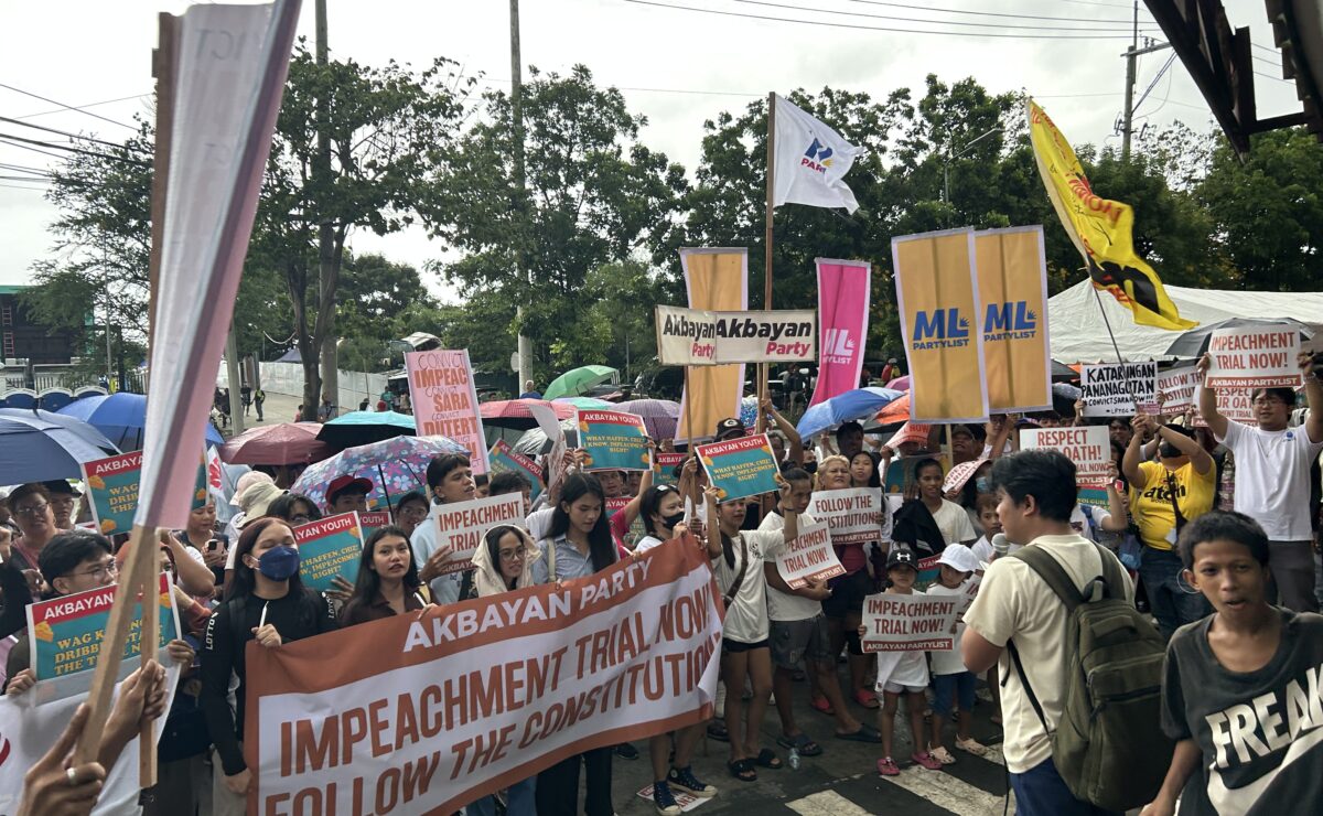 Protesters gather in front of the Senate ahead of the plenary hearing on Tuesday, June 10, 2025. — Zacarian Sarao/INQUIRER.net