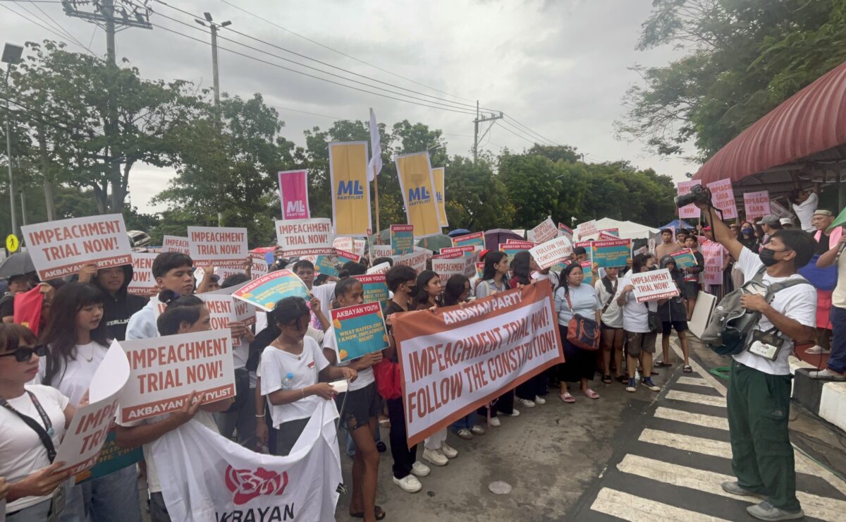 Protesters gather in front of the Senate ahead of the plenary hearing on Tuesday, June 10, 2025. — Zacarian Sarao/INQUIRER.net