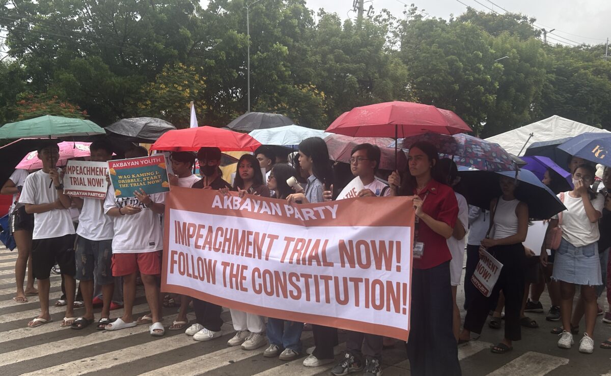 Protesters gather in front of the Senate ahead of the plenary hearing on Tuesday, June 10, 2025. — Zacarian Sarao/INQUIRER.net