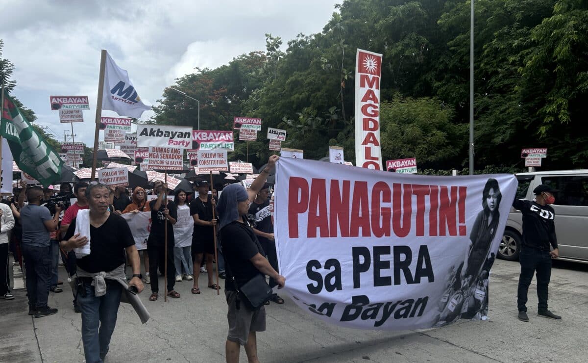 Protesters stage a rally in front of the Senate building in Pasay City on Wednesday, June 11, 2025, calling out the senator-judges for remanding the articles of impeachment against Vice President Sara Duterte to the House of Representatives. — Photo by Zacarian Sarao