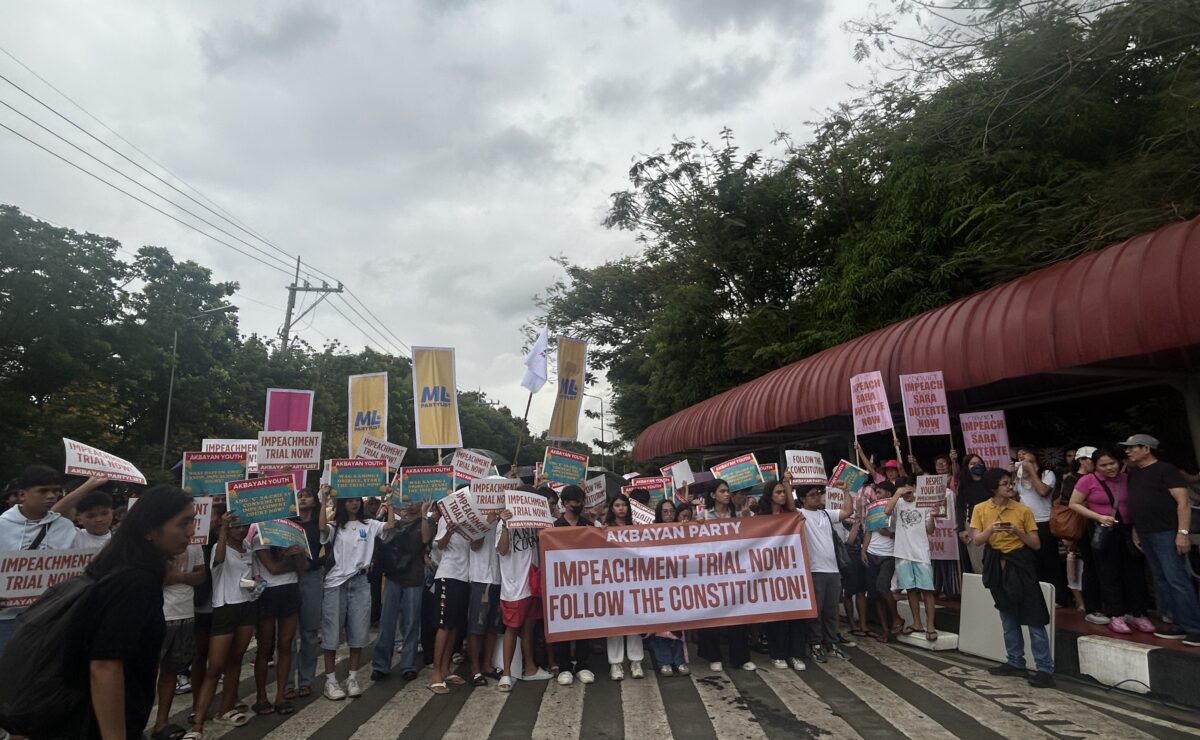 Protesters gather in front of the Senate ahead of the plenary hearing on Tuesday, June 10, 2025. — Zacarian Sarao/INQUIRER.net