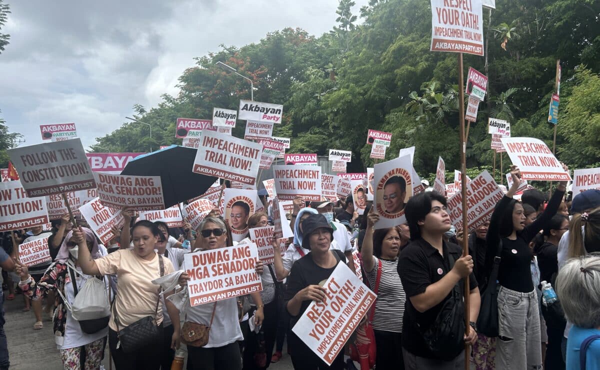 Protesters stage a rally in front of the Senate building in Pasay City on Wednesday, June 11, 2025, calling out the senator-judges for remanding the articles of impeachment against Vice President Sara Duterte to the House of Representatives. — Photo by Zacarian Sarao