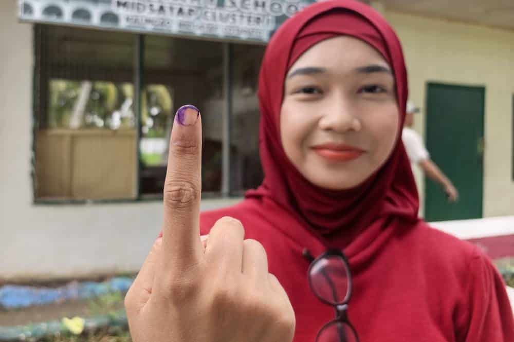 GETTING COUNTED First-time voter Almira Kamin shows her inked finger after casting her ballot at Malingao Elementary School at Kadayangan in the Special Geographic Area of the Bangsamoro Autonomous Region in Mindanao on Monday. Kamin says the historic exercise gives young people like her a chance to make their voices heard and to choose leaders who will serve their communities. &mdash;AMIEL CAGAYAN
