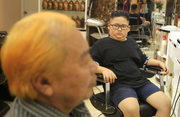 Kim or Trump? Hanoi barber offers leaders' hairdos for 