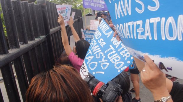 Progressive groups storm Manila Water office